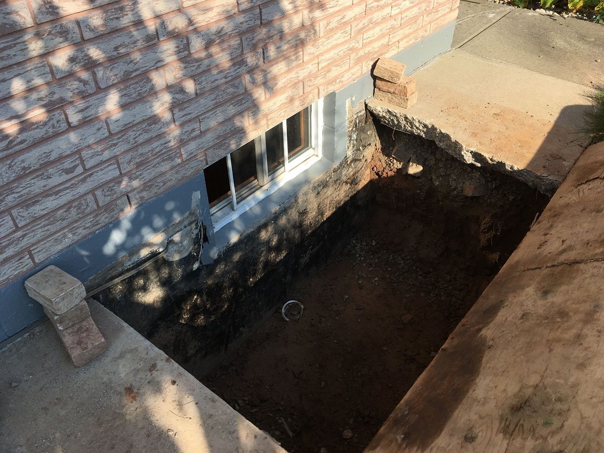 pit dug to install egress window
