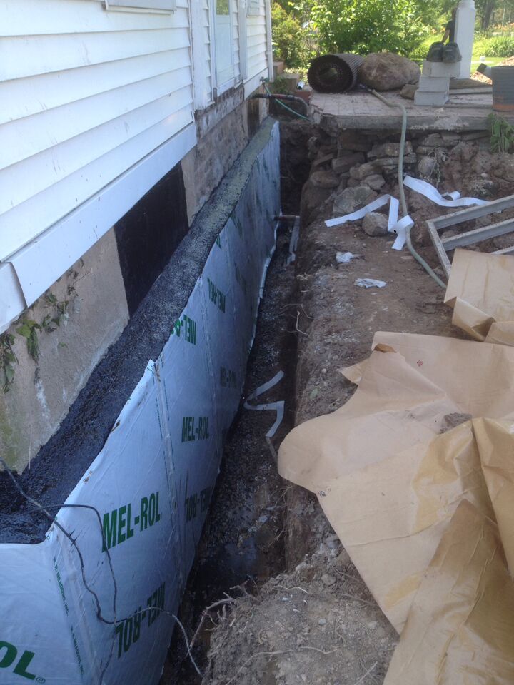 applying weather proofing stone foundation