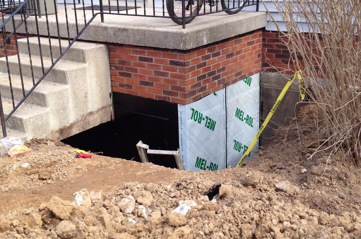 self-adhering waterproofing membrane being applied