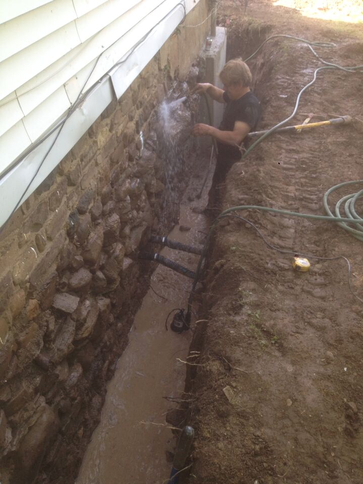 hosing down stone foundation