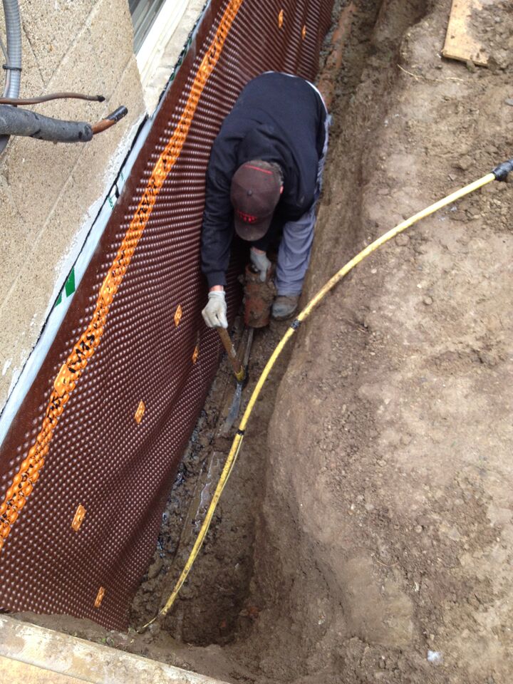 man in foundation ditch